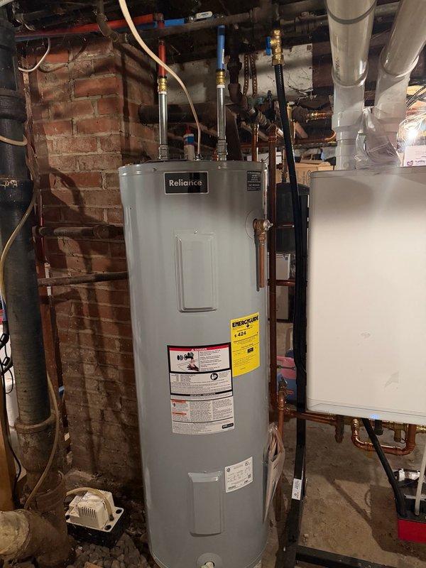 Responded to water leak in basement originating from hose bib fitting connected to main bathroom plumbing. Upon inspection, identified failed hose bib and compromised pipe section in basement ceiling area near mechanical room. Removed defective hose bib and damaged pipe section. Installed new hose bib with proper fittings and replaced affected copper piping to ensure secure, leak-free connections. Tested system under full pressure to verify repair integrity and confirmed no further water intrusion. Documented conditions with photos showing basement infrastructure, water heater area, and repair location for service records.