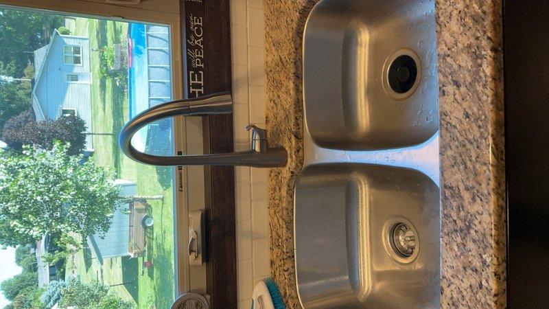 Responded to a slow-draining kitchen sink complaint and successfully cleared a clog located approximately 40 to 50 feet into the drain line using an auger. Additionally cleaned the kitchen sink drain using a 1.5 to 3-inch bladder to ensure proper flow and prevent future blockages.