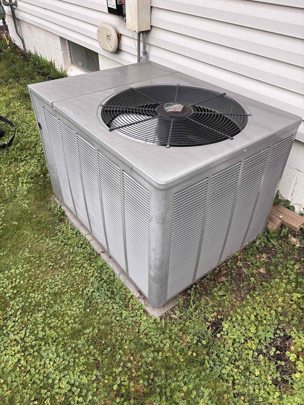 Completed comprehensive AC maintenance on single-zone residential cooling system utilizing R-410A refrigerant with ambient temperature at 61 degrees. Performed full system inspection including air filter, thermostat operation, temperature split analysis, outdoor condenser unit, evaporator and condenser coils, blower motor, capacitors, compressor function, refrigerant charge levels, and condensate drain line. Installed customer-provided 20x25x4 air filter. Identified failed dual-run capacitor (35+10 MFD) and defective service cap requiring replacement. Upon approval, replaced capacitor and service cap, tested system operation, and verified all components functioning within normal parameters. System operating efficiently at completion of service.