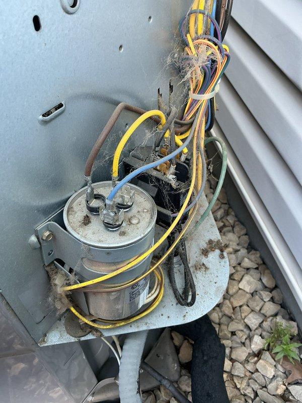Responded to no cooling complaint on 11-year-old residential air conditioning system. Found failed capacitor causing unit malfunction. Replaced capacitor and performed comprehensive system evaluation, identifying failing contactor and condenser fan motor with oil leakage. Verified refrigerant charge within acceptable parameters. Replaced capacitor, contactor, and condenser fan motor to restore full system operation and prevent imminent failures. System tested and confirmed operational upon completion.