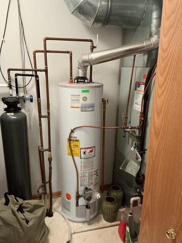 Responded to service call for washer/dryer installation requiring plumbing work. Replaced faulty shut-off valve in washer box that was not functioning properly, ensuring proper water supply connection for new appliances. Inspected existing water heater and filtration system, provided bid for future water heater replacement.