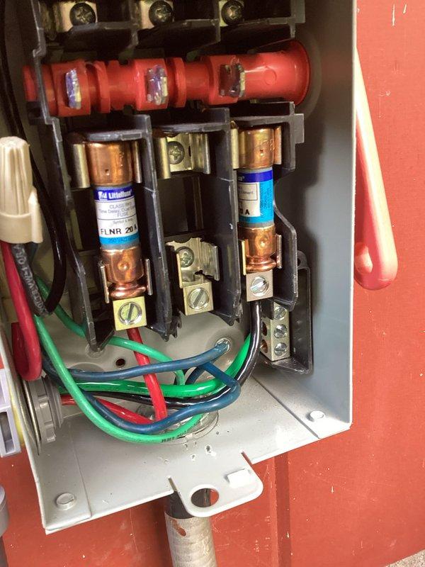 Responded to callback for AC unit lacking proper grounding on high voltage circuit. Identified missing ground wire from interior junction box to exterior condensing unit and absence of proper connector on metallic sealtight conduit. Ran new high voltage wiring from basement junction box above lineset to outdoor unit, installed ground wire through flexible conduit, and added appropriate metallic connector to sealtight flex. Verified all electrical connections at disconnect box and secured proper grounding throughout circuit per code requirements.