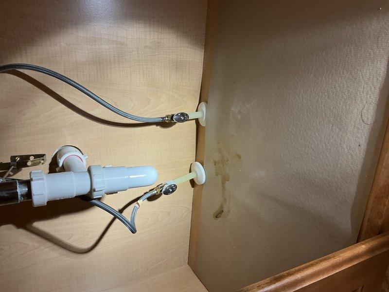 Replaced complete shut-off valve and supply line assemblies for bathroom fixtures. Installed two complete sets, each consisting of a new angle stop valve and braided stainless steel supply line, to address failing components and ensure reliable water shut-off capability during emergencies. All connections were properly secured and tested for leaks to restore safe, functional operation of the plumbing system.
