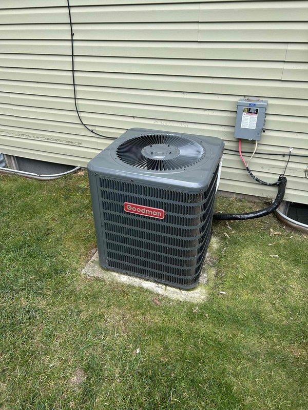 Responded to no-cool complaint on Goodman GSX130241FA condenser (approximately 5 years old, installed 2021-2022, single-phase R-410A system). Found outdoor unit repeatedly blowing 30-amp Edison fuses at disconnect; homeowner had previously replaced capacitor and installed hard start kit with no improvement. Diagnosed one compressor terminal leg electrically grounded to case, with active refrigerant leak detected at same terminal. Confirmed compressor failure requiring replacement and initiated warranty verification due to unit age.