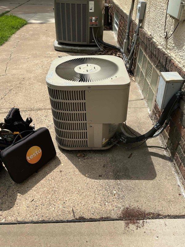 Responded to service call for loud banging noise occurring when AC unit starts up. Diagnosed excessive blower speed on 2-ton system causing ductwork to collapse inward and create popping sound despite proper duct breaks on all sides. Adjusted factory blower setting from excessive CFM to proper 850 CFM for system capacity, which eliminated the noise issue. Performed refrigerant charge verification and identified R22 refrigerant level is low. Scheduled follow-up appointment with service advisor as company policy no longer services R22 refrigerant systems.