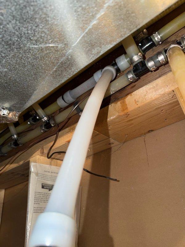 Responded to water leak in mechanical room where a crimp tee fitting on PVC piping had failed and was actively leaking. Isolated the affected section, removed the defective crimp tee connection, and replaced the damaged pipe section with new PVC piping and proper fittings. Tested the repaired system to confirm leak was eliminated and all connections were secure.