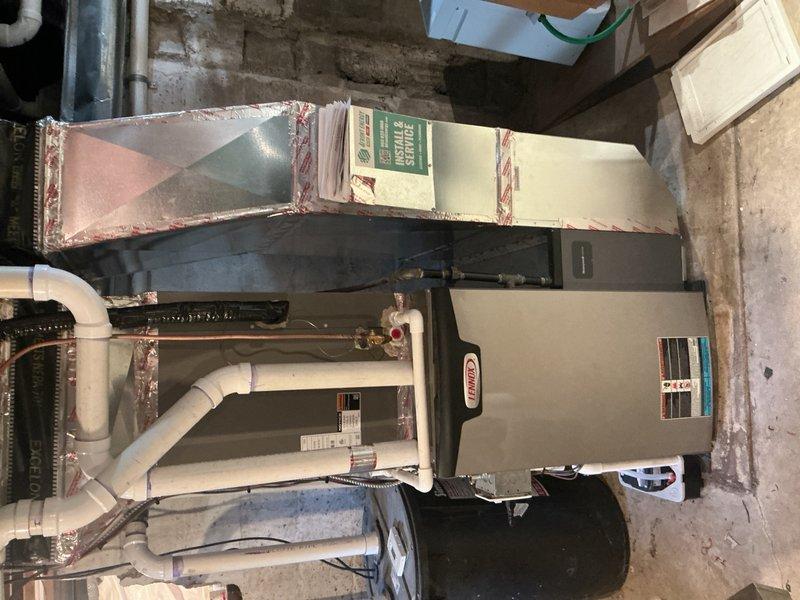 Completed scheduled maintenance on 2-year-old Lennox heat pump and furnace system under maintenance agreement. Performed comprehensive AC tune-up including inspection of outdoor unit coils, electrical connections, control board, and contactor—all components found in good working condition with no debris or rodent nesting. Replaced air filter, verified condensate pump operation, and confirmed refrigerant charge levels within manufacturer specifications. System tested and operating properly, ready for cooling season.