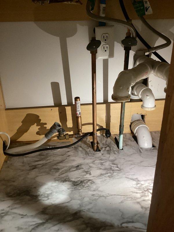 Disconnected all plumbing connections in kitchen to facilitate new countertop installation, including water supply lines and drain lines for sink, dishwasher, and refrigerator. Shut off appropriate water valves and electrical circuits at breaker panel to ensure safe working conditions during cabinet and countertop removal. Follow-up service scheduled to reconnect disposal and complete plumbing hookups after countertop installation is finished.