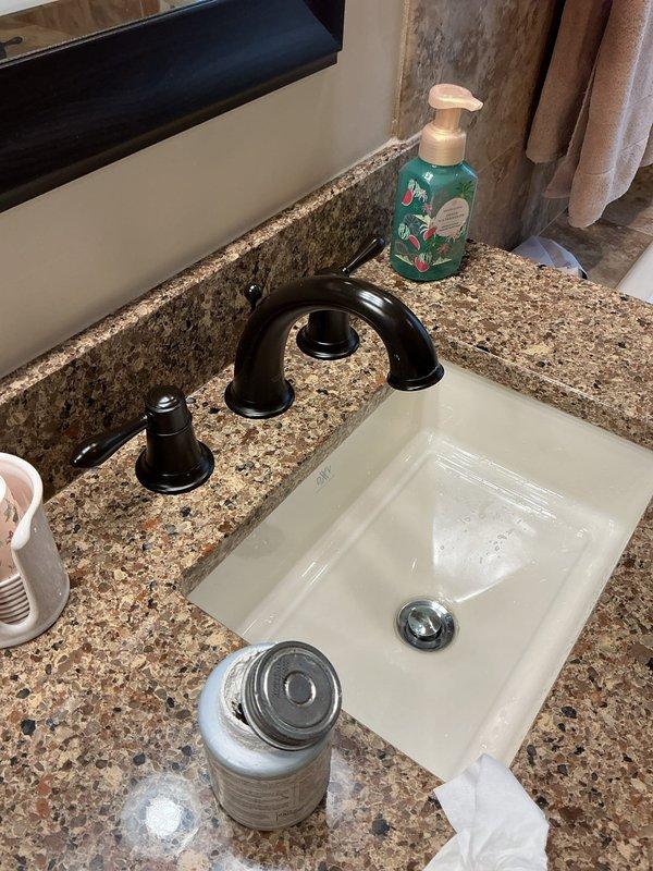 Responded to main bathroom faucet repair request. Upon inspection, identified loose faucet handles and deteriorated aerator causing improper water flow. Adjusted both hot and cold water handles to restore proper operation, replaced faulty aerator, and replaced worn washer to eliminate leak. All fixtures tested and confirmed functioning properly upon completion.