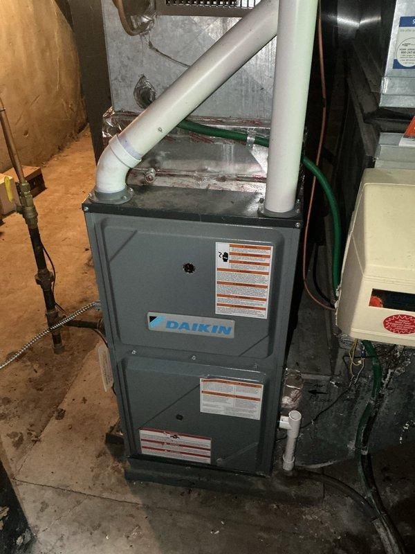 Responded to no cooling complaint with indoor temperature unable to drop below 83 degrees. Upon inspection, diagnosed system as critically low on R22 refrigerant, resulting in frozen evaporator coil that blocked airflow to living space. Performed diagnostic testing on outdoor condenser unit and confirmed refrigerant loss in aging system using obsolete R22. Due to system age and refrigerant phase-out, recommended complete system replacement and scheduled replacement estimate.