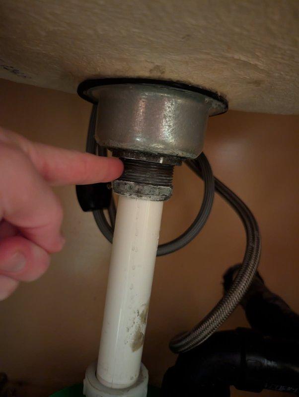 Responded to an active water leak beneath the laundry room sink. Upon inspection, identified a corroded strainer basket as the source of the leak. Attempted to tighten the existing strainer basket, but the leak persisted due to deterioration of the component. Removed and replaced the corroded strainer basket with a new unit. Following installation, performed leak testing by filling the sink basin and draining it three times to verify proper seal and confirm no water discharge from the drain assembly. All connections remained dry with no signs of leakage. Cleaned work area and restored utility room to normal operating condition.