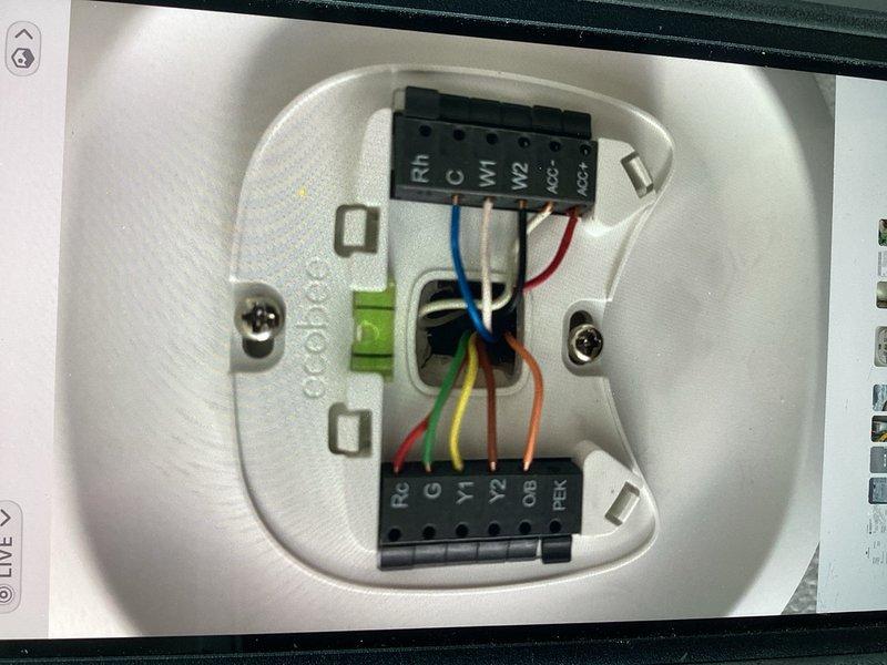 Returned to site to reconfigure system wiring for proper heat pump operation in heating mode, as unit was previously wired for cooling only. Successfully rewired Ecobee thermostat and control board to accommodate 2-stage heat pump with 2-stage gas backup, working around existing humidifier connections that occupied both accessory terminals on the thermostat sub base. Verified all wire connections at both the thermostat terminal block and equipment control board, tested system operation in heating mode, and confirmed proper staging of heat pump and auxiliary heat functions.