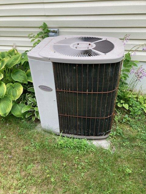 Responded to no cooling complaint on 10-15 year old Carrier air conditioning system. Diagnosed failed capacitor on outdoor condensing unit. Replaced defective capacitor and verified system operation. Unit returned to cooling adequately for age of equipment. Customer aware system is approaching end of service life but elected to continue operation at this time.