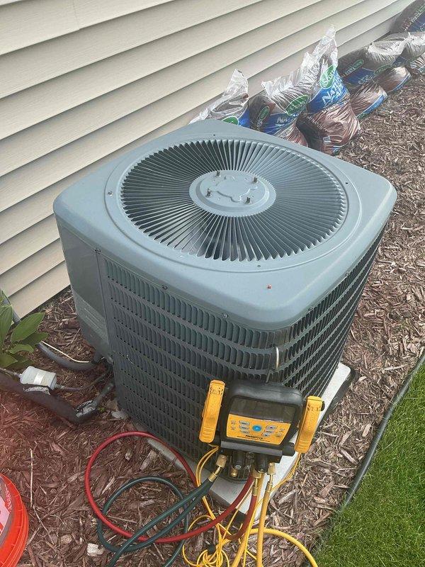 Responded to no cooling complaint on residential air conditioning system. Upon arrival, diagnosed intermittent system cycling caused by loose low voltage wiring connections at the condenser unit. Retightened and secured all low voltage wire connections to ensure proper electrical contact. Performed complete system diagnostics including refrigerant pressure testing using manifold gauges, which confirmed refrigerant charge within manufacturer specifications. Verified proper operation of all system components including compressor, condenser fan motor, and electrical controls. System restored to full operational status with proper cooling output. All components testing within normal parameters.