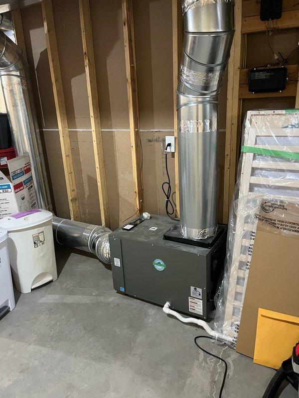 Completed comprehensive AC tune-up on residential split system with all components found operating within manufacturer specifications. Replaced air filter, cleaned outdoor condenser coil, inspected electrical connections and circuit boards, verified capacitor operation, and tested system performance through full 15-minute run cycle with no issues observed.