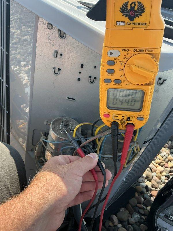 Performed comprehensive AC tune-up on 11-year-old air conditioning system. Verified refrigerant levels within proper range and confirmed all components operating within manufacturer specifications. Conducted electrical diagnostics using digital multimeter, identifying capacitor reading at lower end of acceptable range. Replaced capacitor as preventative maintenance measure to ensure continued reliable operation. System tested and confirmed fully operational upon completion.