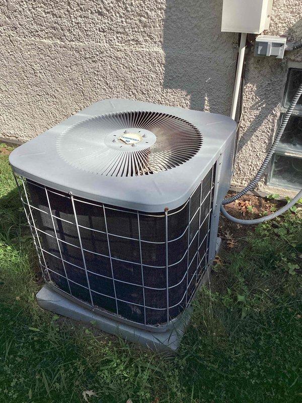 Completed comprehensive air conditioning tune-up on R-22 system with indoor air handler located in attic and outdoor condenser unit. System was found to be low on refrigerant charge; identified leak, evacuated remaining R-22, and recommended full system replacement due to obsolete refrigerant type and age of equipment.