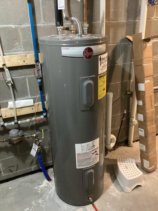 Replaced the dip tube on a Rheem Classic water heater that was experiencing short cycling of hot water. After installing the new dip tube, reinstalled and secured the cold water inlet nipple, restored water supply, and performed leak inspection at all connections with no leaks detected. Conducted a comprehensive flow test by running four fixtures simultaneously for ten minutes to verify proper hot water delivery and temperature maintenance throughout the system. All fixtures maintained consistent hot water temperature during the duration of the test. Unit left in full operational service.