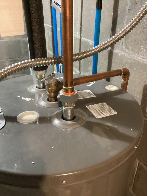 Replaced the dip tube on a Rheem Classic water heater that was experiencing short cycling of hot water. After installing the new dip tube, reinstalled and secured the cold water inlet nipple, restored water supply, and performed leak inspection at all connections with no leaks detected. Conducted a comprehensive flow test by running four fixtures simultaneously for ten minutes to verify proper hot water delivery and temperature maintenance throughout the system. All fixtures maintained consistent hot water temperature during the duration of the test. Unit left in full operational service.