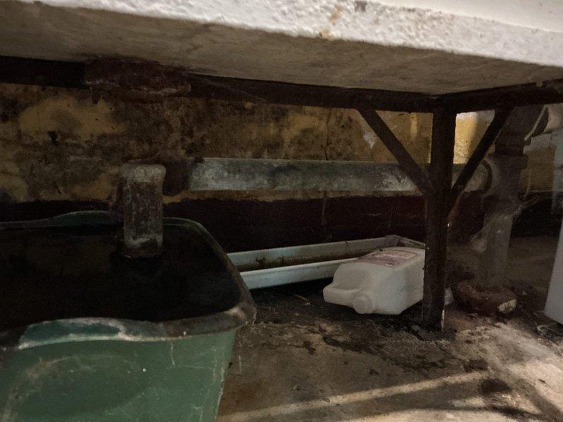 Responded to multiple plumbing issues including a leaking outdoor hose spigot, backed-up floor drain, and deteriorating laundry tub requiring replacement. Upon inspection, determined the existing hose spigot and valve had failed seals and the unit was not frost-free, creating vulnerability to freeze damage. The floor drain was obstructed with accumulated debris in the trap and drain line.

Cleared the floor drain by cabling and vacuuming all debris from the trap and line, then performed a water flow test to verify proper drainage. Removed the failed hose spigot and valve assembly, then installed a new frost-free spigot with a new ball valve equipped with bleeder. Tested the new installation for proper operation and confirmed all components were functioning correctly with no leaks present.