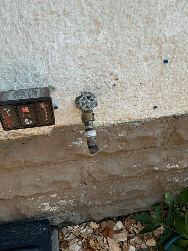 Responded to multiple plumbing issues including a leaking outdoor hose spigot, backed-up floor drain, and deteriorating laundry tub requiring replacement. Upon inspection, determined the existing hose spigot and valve had failed seals and the unit was not frost-free, creating vulnerability to freeze damage. The floor drain was obstructed with accumulated debris in the trap and drain line.

Cleared the floor drain by cabling and vacuuming all debris from the trap and line, then performed a water flow test to verify proper drainage. Removed the failed hose spigot and valve assembly, then installed a new frost-free spigot with a new ball valve equipped with bleeder. Tested the new installation for proper operation and confirmed all components were functioning correctly with no leaks present.
