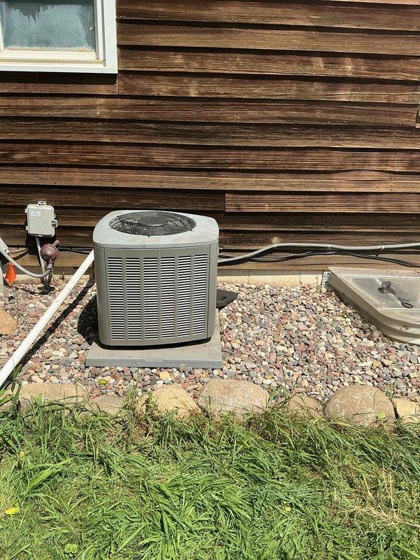 Responded to no cooling call on R22 air conditioning system over 10 years old. Found outdoor fan motor not operating, causing complete loss of cooling capacity. Diagnosed failed dual capacitor as root cause of fan motor failure. Replaced dual capacitor with proper rated component, restoring normal operation to condenser fan motor and compressor. System tested and confirmed operational with adequate airflow through condenser coil.