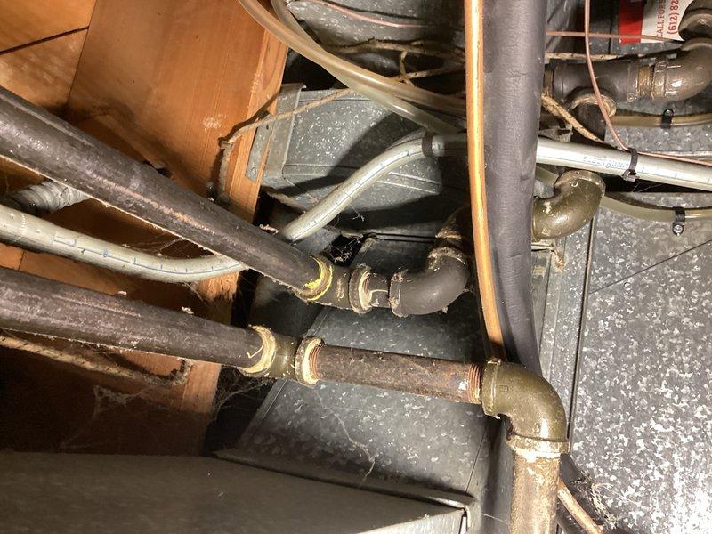 Responded to gas leak emergency where the utility company was on-site and had identified multiple gas leaks on both HVAC units' gas lines. Documented all leak locations marked by the utility company, including a pinched copper gas line behind the oven requiring replacement. Photographed the affected gas piping connections, valves, and compromised copper lines showing visible damage to the gas supply infrastructure. Verified the residence was properly ventilated for safety. Completed comprehensive documentation of all required repairs including gas line replacement and leak remediation work. Submitted detailed follow-up documentation with photographic evidence for estimate preparation and scheduling of installation work.