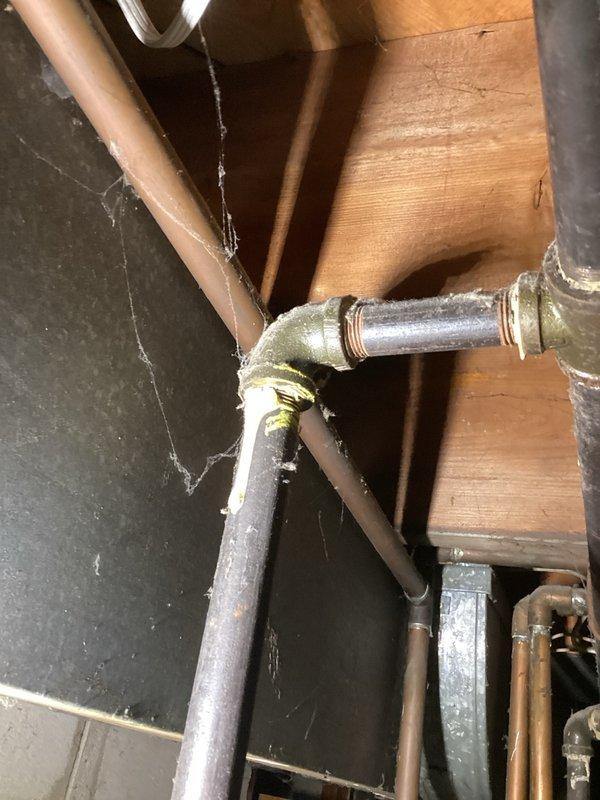 Responded to gas leak emergency where the utility company was on-site and had identified multiple gas leaks on both HVAC units' gas lines. Documented all leak locations marked by the utility company, including a pinched copper gas line behind the oven requiring replacement. Photographed the affected gas piping connections, valves, and compromised copper lines showing visible damage to the gas supply infrastructure. Verified the residence was properly ventilated for safety. Completed comprehensive documentation of all required repairs including gas line replacement and leak remediation work. Submitted detailed follow-up documentation with photographic evidence for estimate preparation and scheduling of installation work.