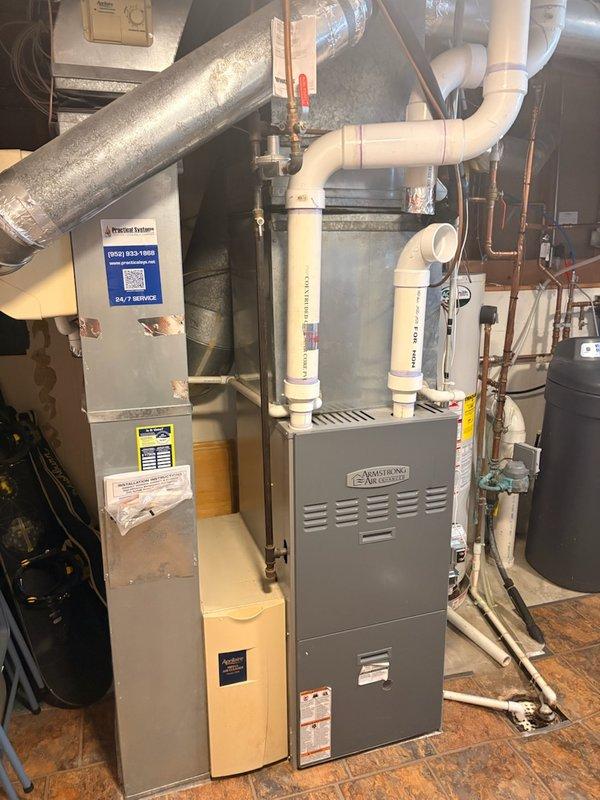 Performed home sale inspection on 20-year-old furnace and air conditioning system. Furnace inspection revealed critical safety hazard with carbon monoxide levels exceeding 700 ppm in the flue due to secondary heat exchanger rusted through from inside out, causing carbon monoxide leakage into living space. Additional findings included failing flame sensor and ignitor, plus control board exhibiting burn marks around resistors. Unit red-tagged as unsafe to operate. Air conditioning inspection showed system fully operational with proper refrigerant charge, 19-degree temperature split across evaporator coil, and all components testing within manufacturer specifications. Scheduled furnace replacement estimate. Recommend immediate furnace replacement due to life safety concerns.