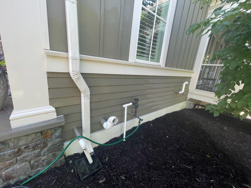 Responded to a call for a cracked PVC fitting on an exposed irrigation line. Upon arrival, identified a damaged white PVC pipe fitting with a vertical crack and discoloration from age and mineral deposits. Removed the failed fitting and installed a new PVC connector to restore system integrity. After installation, activated the irrigation system and conducted a 10-minute pressure test to verify proper operation and confirm no leaks were present. System was left in full service with all components functioning correctly.