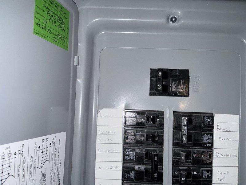 Responded to service call for bedroom above unheated garage experiencing inadequate heating in winter and excessive heat in summer. Assessed room conditions and determined insufficient insulation and lack of proper climate control as primary issues. Documented existing electrical panel configuration and available circuit capacity for potential supplemental baseboard heating system installation. Provided estimate for adding supplemental baseboard heat/cooling system to address temperature control deficiencies in the affected space.