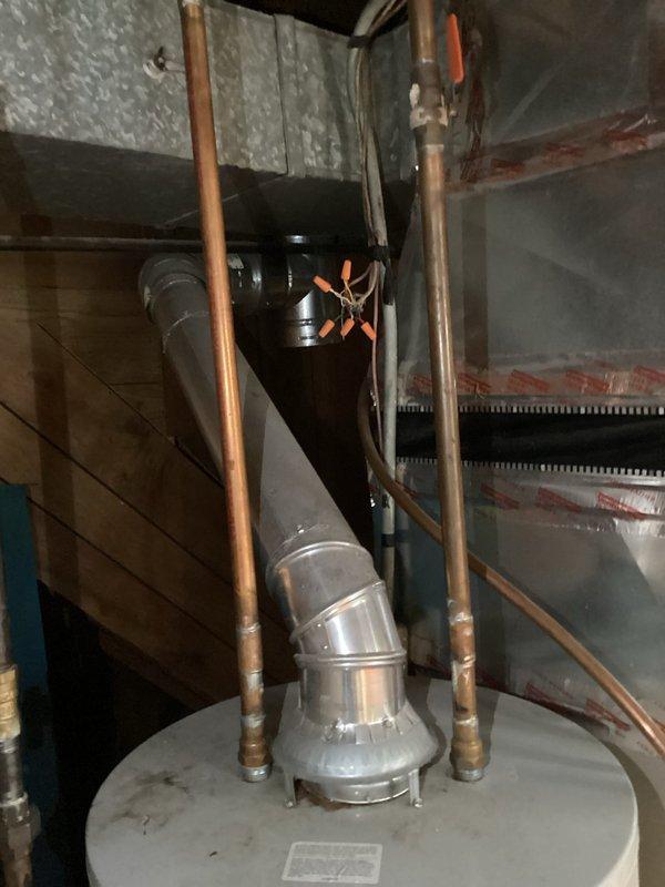 Completed certified safety inspection on residential furnace and HVAC system for rental property compliance. Performed comprehensive evaluation of heating equipment, water heater, venting systems, and thermostat operation. Inspected flue pipe assembly, ductwork, and exhaust connections for proper installation and safety. Verified thermostat functionality showing proper display and control settings. Examined all mechanical components including gas lines, electrical connections, and safety controls. All systems passed inspection with no deficiencies noted. Certification letter generated and provided for rental licensing requirements.