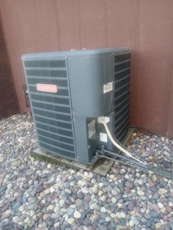 Responded to no cooling complaint on residential air conditioning system. Upon inspection, diagnosed low refrigerant charge on R22 system. Verified filter and evaporator coil condition were acceptable. Measured inadequate cooling output and confirmed refrigerant deficiency in outdoor Goodman condensing unit. Due to R22 phase-out and system age, scheduled comfort advisor appointment to provide system replacement estimate rather than recharging obsolete refrigerant.