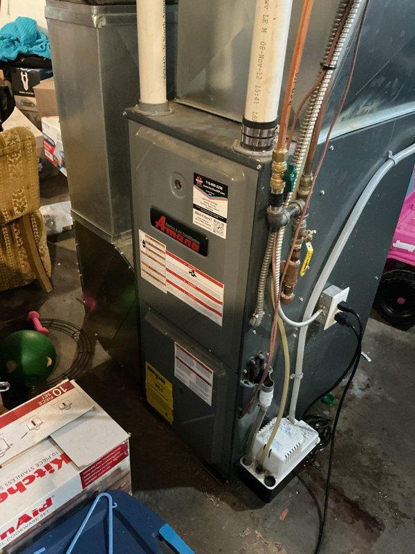 Performed comprehensive AC tune-up on 4-year-old Lennox outdoor unit. Rinsed condenser coil and exterior components to remove debris and improve heat transfer efficiency. Conducted full system inspection of all accessible components including electrical connections, refrigerant lines, and condensate drainage. System demonstrated proper operation with 15°F temperature split across the evaporator coil and active condensate production, confirming adequate cooling capacity and dehumidification. All components functioning within normal parameters at time of service completion.