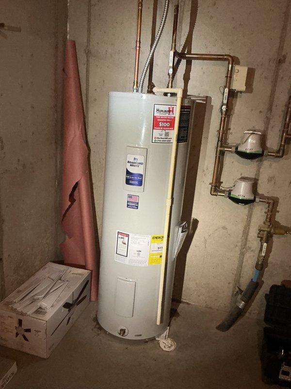 Responded to no hot water complaint and found tripped breaker with active leak from bottom of existing water heater tank. Removed and disposed of failed unit. Installed new 50-gallon electric Bradford White water heater with proper copper piping connections, dielectric unions, temperature and pressure relief valve, and electrical wiring to code. Tested system operation, verified no leaks, restored hot water service, and confirmed proper breaker function.
