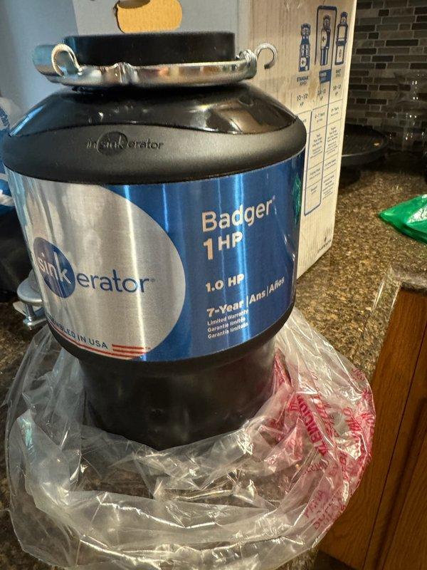 Performed site evaluation for customer-supplied InSinkErator Badger 1 HP garbage disposal installation. Upon inspection, identified high rough-in position of kitchen sink drain line, which presented clearance issues for proper disposal mounting. Advised that installation would require cabinet modification to access wall drain, lowering of drain pipe penetration point, and complete re-piping of under-sink plumbing configuration to accommodate unit specifications. Provided detailed estimate outlining necessary structural and plumbing modifications. Customer declined to proceed with installation at this time.