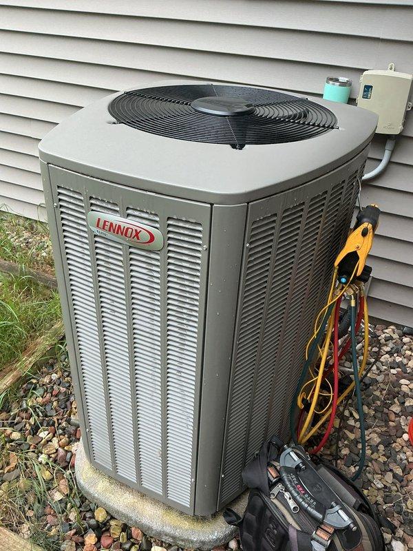 Completed annual cooling maintenance on a 1-year-old Lennox air conditioning system under warranty. Performed comprehensive tune-up including refrigerant charge verification, temperature split analysis, and full system diagnostics using digital manifold gauges. All components tested within manufacturer specifications with proper superheat and subcooling readings confirmed, and unit found to be fully operational with no deficiencies noted.