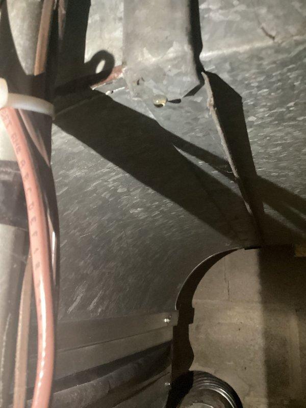 Performed comprehensive annual AC tune-up on 4-year-old Day and Night air conditioning system. Inspected and verified all major components including contactor, capacitor, condenser coil, control board, and evaporator coil—all found to be in good working condition. Confirmed proper amp draws, refrigerant charge levels, and temperature drop at 19 degrees, which is within manufacturer specifications. Furnace filter was clean and airflow was adequate.

Identified excessive humidity in mechanical room causing condensation on supply ductwork seam, resulting in water dripping onto floor. Recommended applying silicone sealant to affected ductwork seam once dried and installing dehumidifier in mechanical room to control ambient moisture levels and prevent future condensation issues. System is operating efficiently with no immediate repairs required.