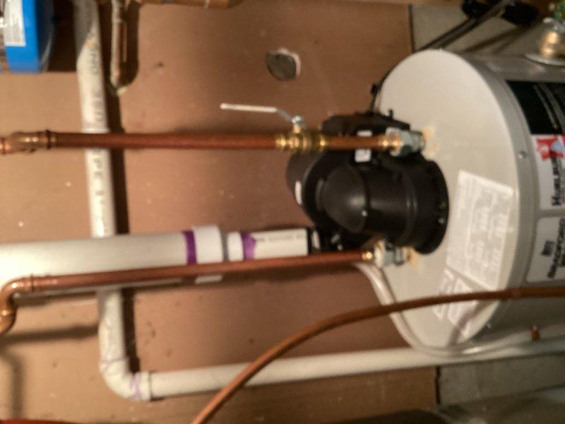 Responded to service call for gas water heater experiencing active leaks from both top and bottom of unit. Upon inspection, confirmed significant water discharge from multiple points on the tank, indicating catastrophic failure of the vessel integrity. Unit was determined to be covered under manufacturer warranty. Proceeded with complete water heater replacement, removing the failed unit and installing new gas-fired storage water heater. Connected all copper supply lines, gas piping, and temperature/pressure relief valve discharge piping to code specifications. Installed proper venting system and verified all connections for proper operation and absence of leaks. Tested new unit for functionality, confirmed proper ignition sequence, and verified adequate hot water delivery throughout the system.