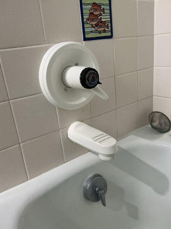 Responded to service call for multiple plumbing issues including clogged tub drain, leaking faucets, loose laundry faucet, and intermittently sticking toilet handle. Upon diagnostic assessment, identified primary blockage in upstairs bathtub drain suspected to be hair accumulation. Successfully cabled tub drain and extracted large hair ball, restoring proper drainage and flow. Tightened loose laundry faucet to secure mounting. Adjusted toilet handle mechanism to resolve intermittent sticking issue.

During inspection, identified additional issues in basement requiring future attention: leaking Monitor brand shower valve requiring cartridge replacement and dripping three-hole faucet recommended for replacement. Due to time constraints and lack of appropriate cartridge on hand, basement repairs were deferred to subsequent appointment. As courtesy service, removed cartridge from upstairs bathroom faucet for homeowner self-replacement. Primary objective of clearing clogged tub drain comple