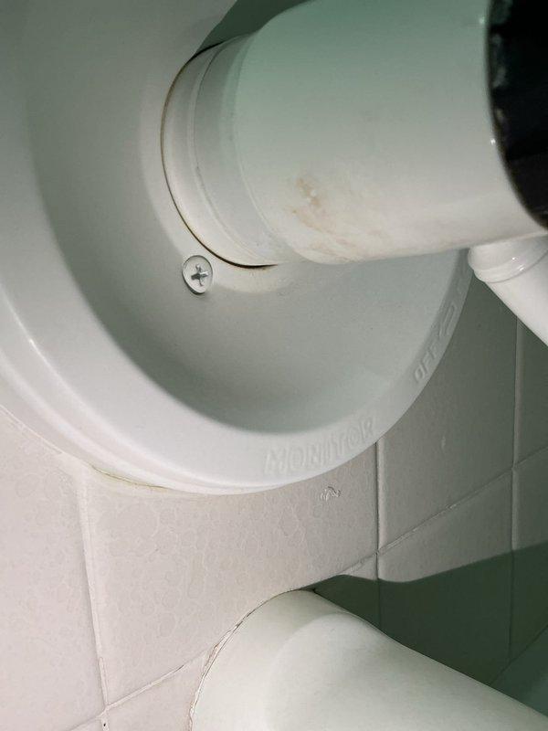 Responded to service call for multiple plumbing issues including clogged tub drain, leaking faucets, loose laundry faucet, and intermittently sticking toilet handle. Upon diagnostic assessment, identified primary blockage in upstairs bathtub drain suspected to be hair accumulation. Successfully cabled tub drain and extracted large hair ball, restoring proper drainage and flow. Tightened loose laundry faucet to secure mounting. Adjusted toilet handle mechanism to resolve intermittent sticking issue.

During inspection, identified additional issues in basement requiring future attention: leaking Monitor brand shower valve requiring cartridge replacement and dripping three-hole faucet recommended for replacement. Due to time constraints and lack of appropriate cartridge on hand, basement repairs were deferred to subsequent appointment. As courtesy service, removed cartridge from upstairs bathroom faucet for homeowner self-replacement. Primary objective of clearing clogged tub drain comple