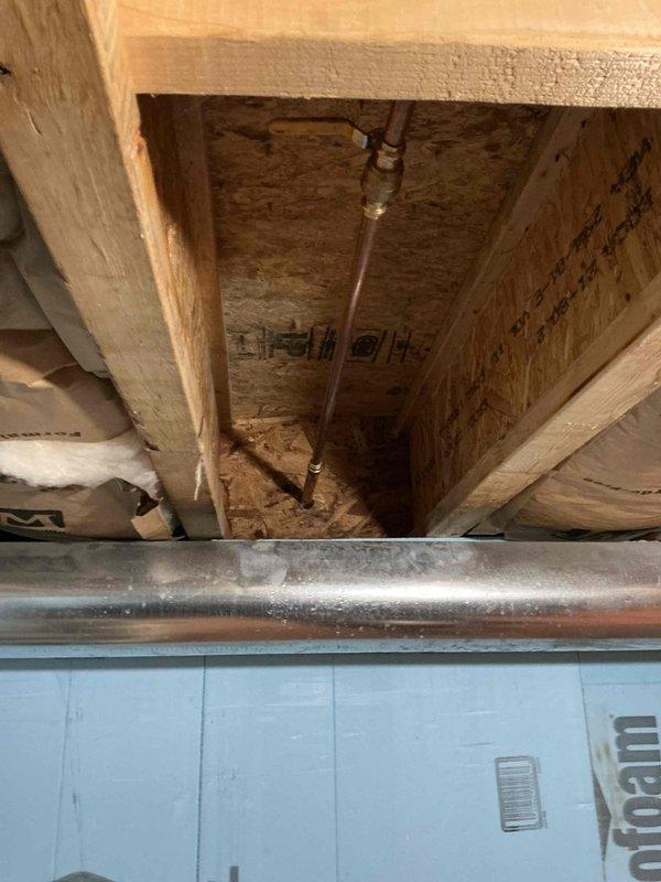 Responded to a frozen and cracked hose bibb that resulted from improper installation and inadequate drainage. The exterior spigot supply line, approximately 3 feet in length, sustained freeze damage due to incorrect grading that allowed water to remain trapped in the fixture. Removed the damaged hose bibb, installed a new frost-proof hose bibb with proper pitch to ensure complete drainage, and verified the dedicated shut-off valve was functioning correctly to allow for seasonal winterization.