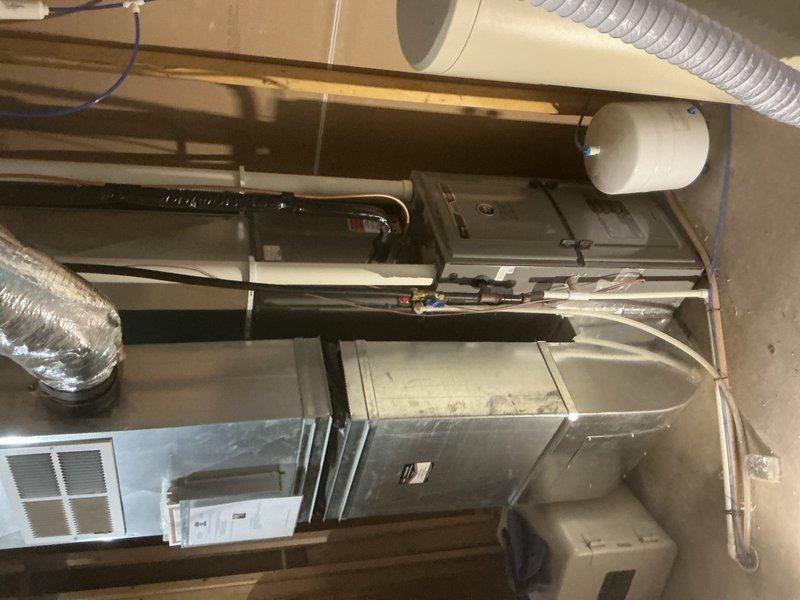 Responded to no hot water complaint and performed annual plumbing inspection. Diagnosed tanked water heater issue and determined the breaker for the power vent had tripped, causing loss of hot water. Reset breaker to restore power to the water heater power vent system. Conducted comprehensive plumbing inspection of entire home, checking all fixtures, supply lines, drain lines, and water heating equipment. Verified water heater returned to normal operation after breaker reset. All plumbing systems inspected and found to be functioning properly with no active leaks detected.