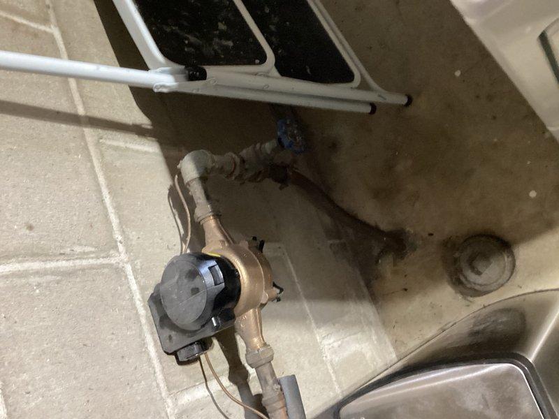 Conducted on-site evaluation of existing toilet and plumbing valve assembly for replacement estimates. Assessed aging toilet fixture showing signs of wear and evaluated multi-port brass valve assembly with visible tarnishing and mineral deposits. Documented current conditions of both fixtures through photographic inspection, noting deterioration of valve components and floor area water damage around plumbing connections. Provided comprehensive replacement estimates for toilet fixture upgrade and valve assembly replacement to address aging infrastructure concerns.