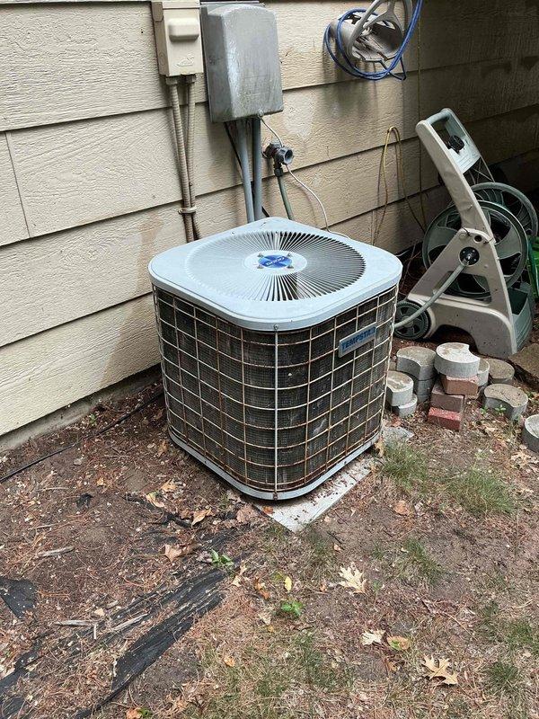 Responded to no cooling complaint on 12-year-old air conditioning system. Upon arrival, verified system was running but failing to achieve adequate cooling. Performed diagnostic testing on outdoor condenser unit, including capacitor testing which showed slightly low readings but within acceptable range. Checked refrigerant pressures and found abnormal readings indicating poor refrigerant circulation through the system. Conducted component testing and system analysis to isolate the issue. Diagnostics confirmed internal compressor failure preventing proper refrigerant pumping and heat transfer. Explained findings to homeowner, noting that compressor failure is common in systems of this age. Due to the age of the unit and cost-effectiveness of repair versus replacement, coordinated with service advisor to schedule estimate for complete system replacement.