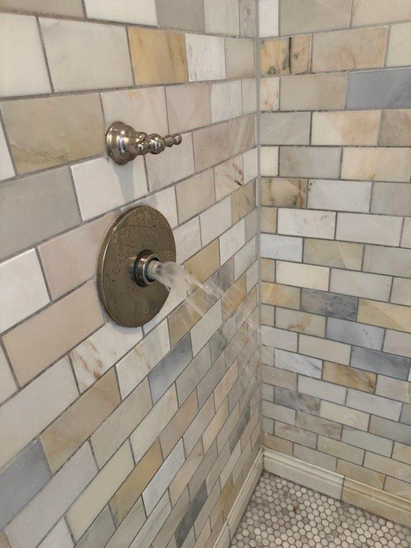 Responded to service call for inoperative master bathroom shower with broken cartridge. Diagnosed failed cartridge in shower valve assembly and instructed homeowner on isolation procedure to shut off water supply to the affected fixture while maintaining water service to remainder of residence. Discussed replacement options with homeowner, who elected to defer repair due to planned bathroom remodel. Successfully isolated shower valve, restored water service to house, and verified no leaks present in system upon completion.