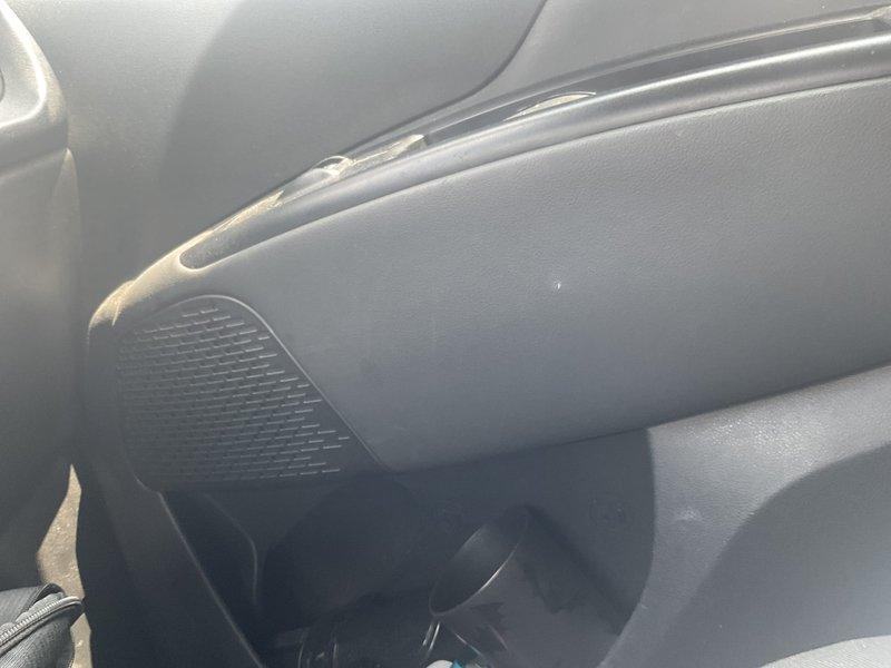 Conducted scheduled phone follow-up to review detailed estimate with customer and address questions regarding air conditioning system replacement scope and pricing breakdown. Documented vehicle interior conditions with photos showing dashboard, glove compartment area, and ventilation components for service records.
