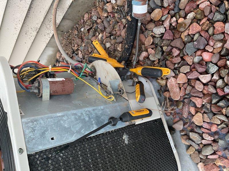 Performed annual maintenance on 23-year-old R22 air conditioning system that had not been serviced in approximately eight years. Homeowner reported diminished airflow and reduced cooling capacity in upper level over time. Upon inspection, discovered dual filtration issue: new filter present in filter rack, but second filter lodged against blower assembly that appeared over one year old and heavily restricted. Removed old filter from blower compartment, resulting in immediate improvement to system airflow. 

Tested capacitor rated at 35/5 µF, reading 25.6/4.9 µF—within acceptable range but showing age-related degradation. Conducted refrigerant analysis on R22 system and determined unit appears slightly undercharged, though no leak testing performed at this time. Documented findings and advised homeowner that system has reached legacy status due to age and R22 phase-out. Recommended consultation with comfort advisor to discuss system replacement options given equipment age and performanc