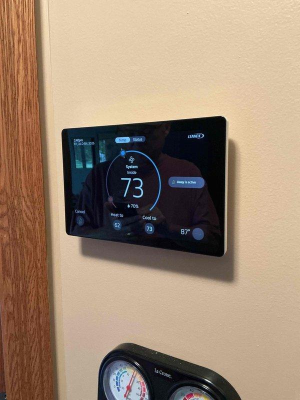 Responded to callback from recent system installation to assist with thermostat programming and mobile connectivity. Successfully configured Lennox digital thermostat for remote access and connected homeowners' mobile devices to enable app-based control and monitoring. System now fully operational with remote temperature adjustment capabilities functioning properly.
