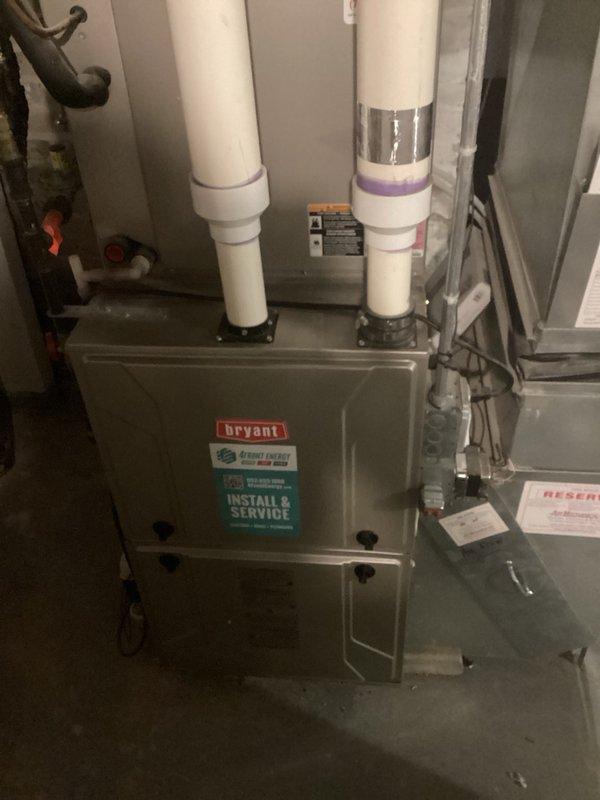Responded to callback for zone system damper malfunction. Upon inspection, discovered the 2nd/3rd floor zone wiring was incorrectly connected to zone 3 position instead of zone 2 position on the zone panel and relocated wiring to proper terminal. Found stopping bars on both zone damper motors for 2nd/3rd floor zones were improperly positioned, preventing full range of motion. Adjusted stopping bars on both motors to allow complete opening and closing operation. Cycled system through all zone combinations and verified all three zone dampers now operate as designed. Noted one zone motor required manual assistance to close on initial test but functioned properly on subsequent cycles, indicating potential early-stage motor failure. Measured voltage drop from 40VA transformer showing 26.5V at source but only 24.5V at zone panel, which currently powers zone panel, three zone motors, and two thermostats—voltage may become insufficient for reliable operation if it drops below 24V.